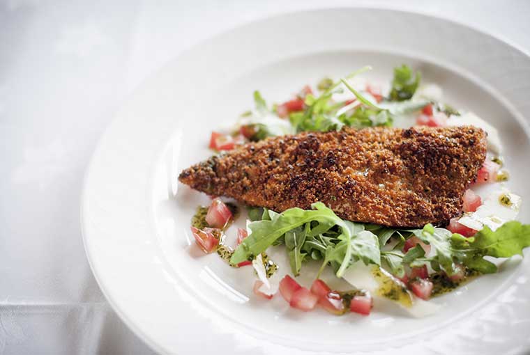 Mackerel fillet with a sun-dried tomato crust, rocket leaves and parmesan shavings recipe