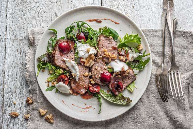 Ras el hanout lamb, goats’ cheese & walnut salad with a cherry dressing recipe