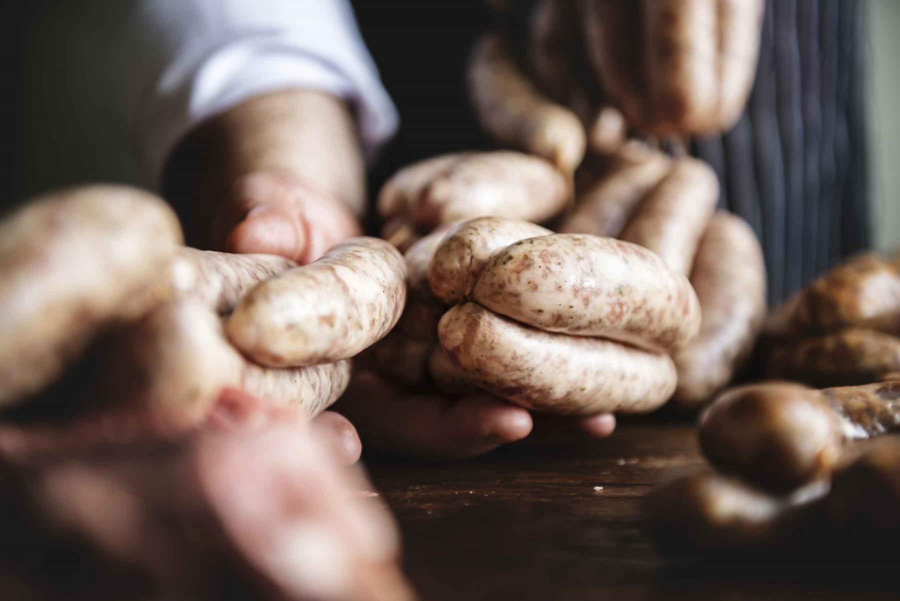 Sausages held by butcher