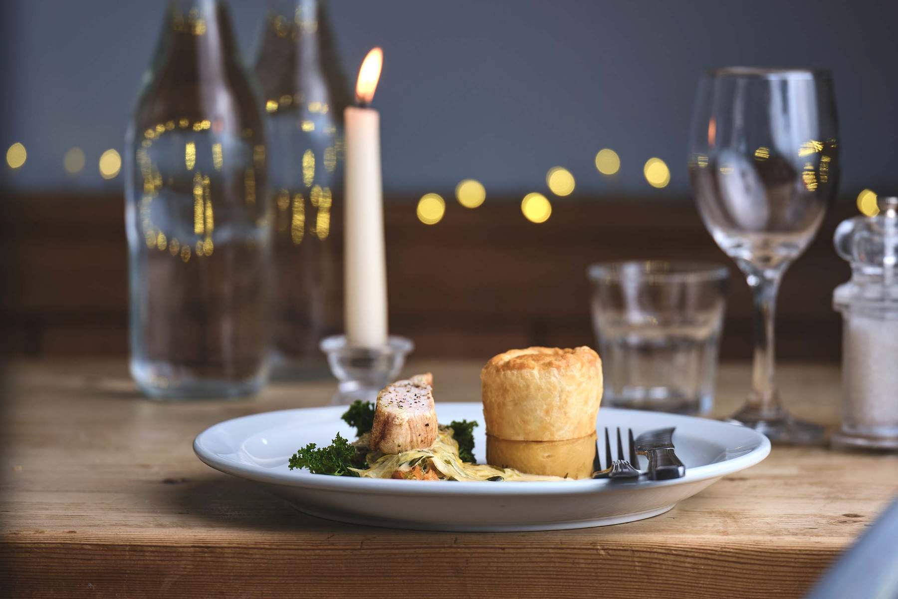 A dish from the evening menu at Home Farm Cafe: Seared chicken breast, chicken and chorizo pie, fondant potato, glazed carrots, leek cream