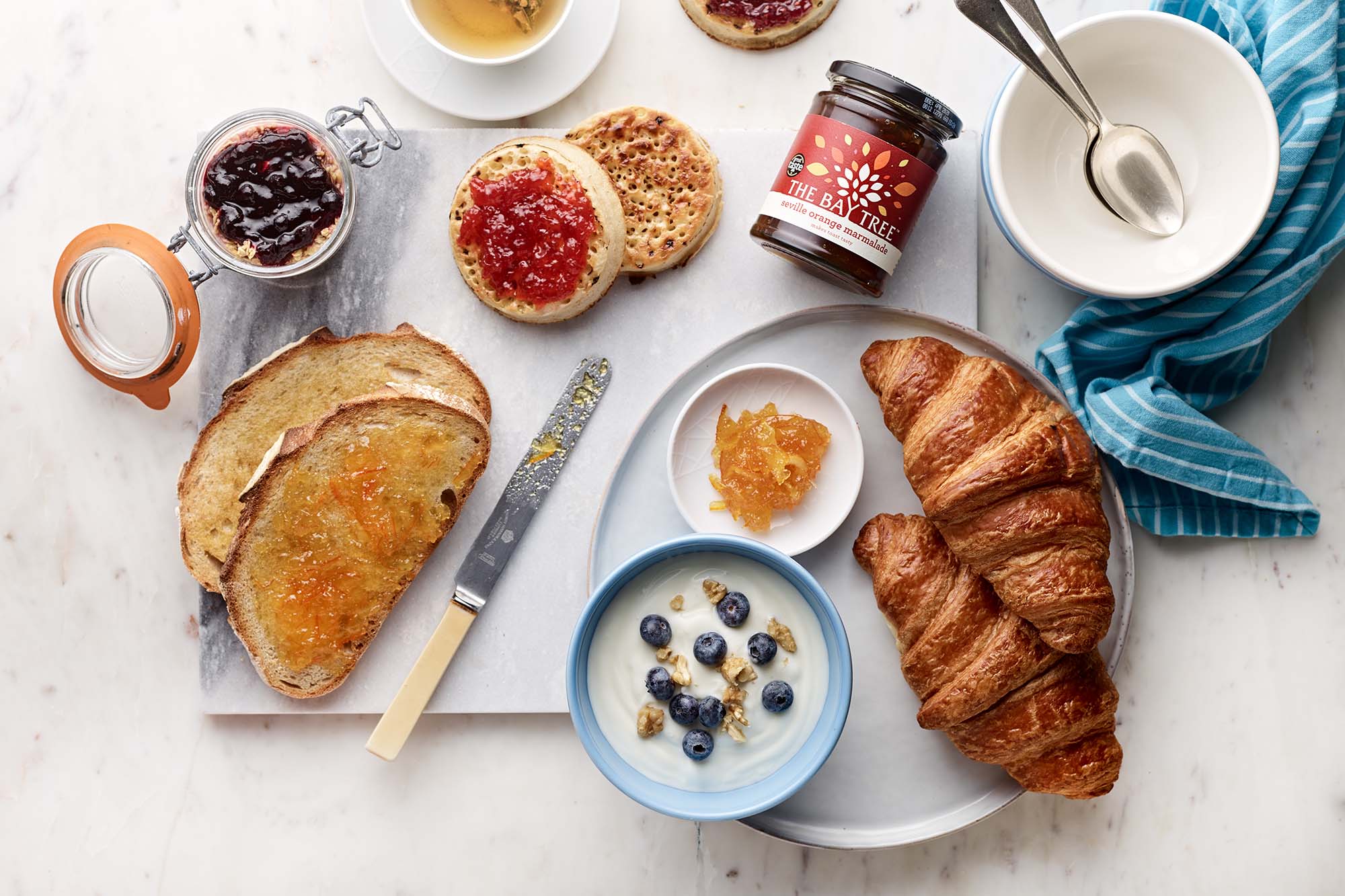 Breakfast image with Seville Marmalade, toast, crumpets and croissants. The Bay Tree. 