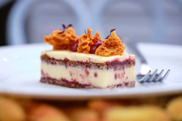 A dish served on the dinner menu at Home Farm Café – cherry and white chocolate tarte chocolate sponge