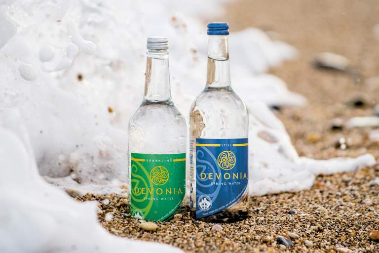 Devonia Water. Returnable bottles on beach