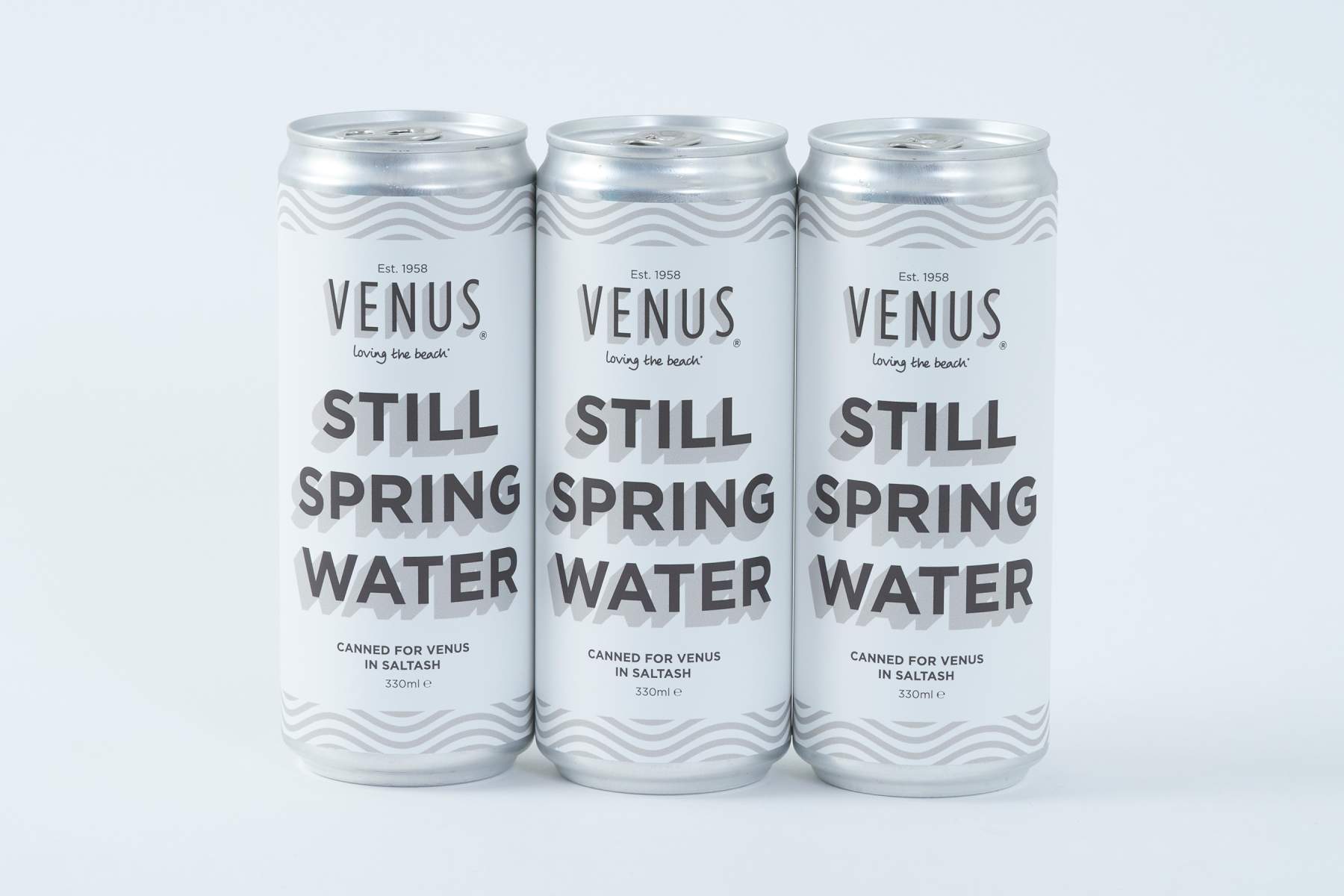 Venus serves it's spring water in cans